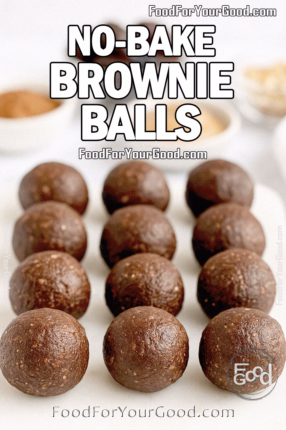 Homemade No-Bake Brownie Balls on a white marble tray with blurred walnuts, dates, cocoa, and almond butter in the background.