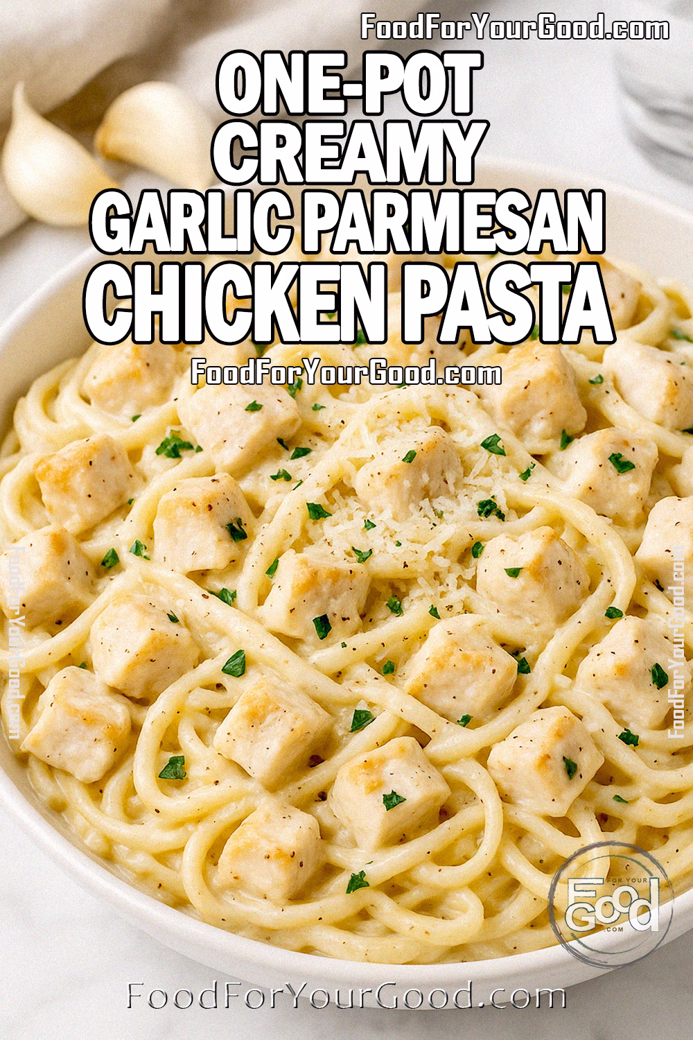 One-Pot Creamy Garlic Parmesan Chicken Pasta in a white bowl with parsley and Parmesan, styled on white marble for FoodForYourGood.com