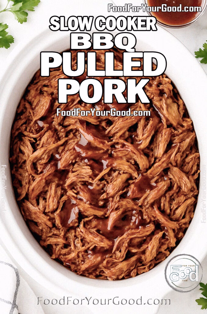Slow Cooker BBQ Pulled Pork Slow Cooker BBQ Pulled Pork in a white slow cooker, tender shredded meat drizzled with barbecue sauce, styled on a marble countertop with fresh parsley, garlic, and a white towel.