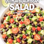 Southwest Quinoa Black Bean Salad served in a white bowl on a marble countertop with lime wedges, avocado, corn, and fresh cilantro.