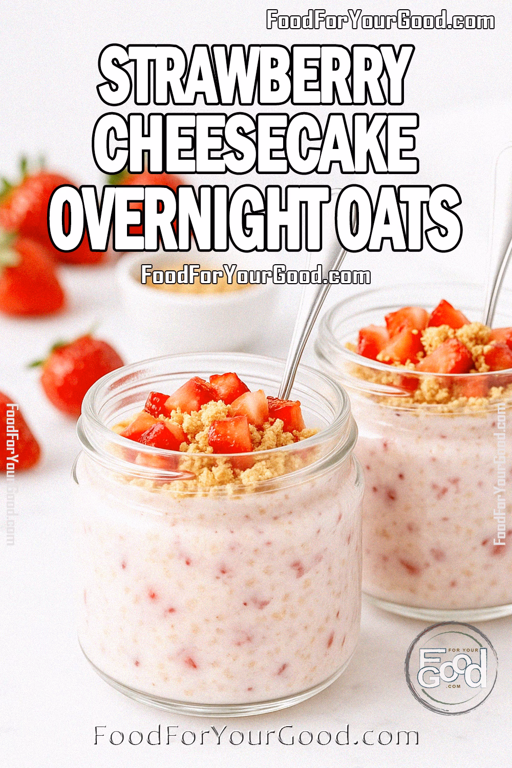 Strawberry Cheesecake Overnight Oats in glass jars with silver dessert spoons, topped with diced strawberries and graham cracker crumbs on a white marble surface.