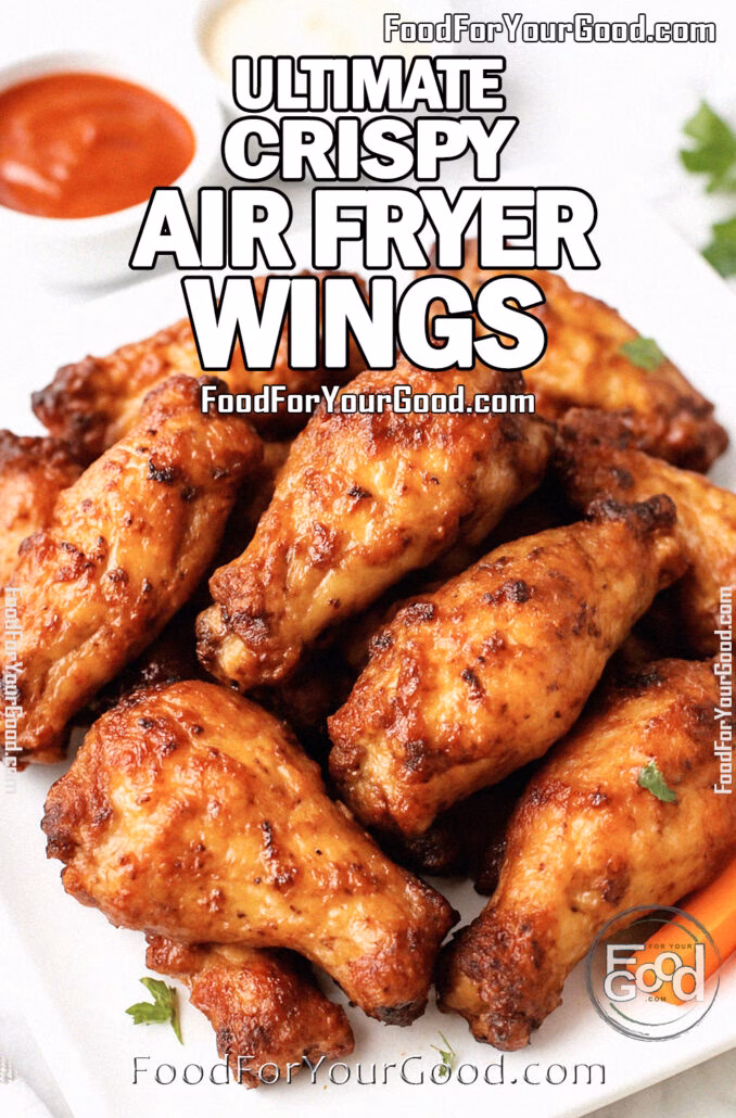 Juicy, crispy Ultimate Air Fryer Chicken Wings on a white square plate, garnished with parsley, served with marinara and cheese dips on a white marble background.